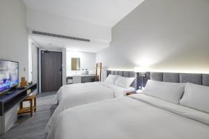 Postel nebo postele na pokoji v ubytování Hotel Z