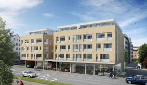 a rendering of a large building on a street at Apartment "SUN" in Friedrichshafen