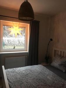 Postel nebo postele na pokoji v ubytování Apartmány Trio Krkonoše + 15 fotografií