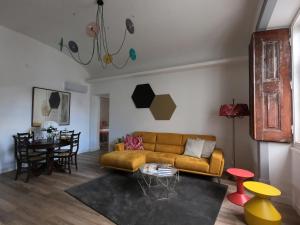 a living room with a couch and a table at Casa Eborim - SPHomes in Évora