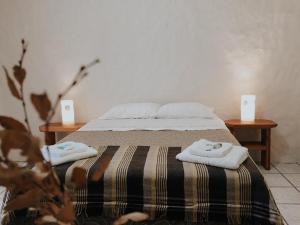 Una cama o camas en una habitación de Hostería de Montaña Las Pataguas