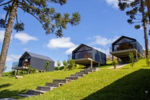 a house on a hill with stairs and trees at Cappio Pousada e Lazer in Bento Gonçalves +23 photos