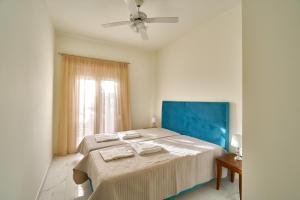 Giường trong phòng chung tại Villa Calliope +18 ảnh