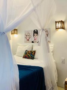 Tempat tidur dalam kamar di Pousada Flor de Pitaya