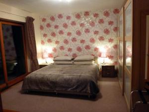 Ένα ή περισσότερα κρεβάτια σε δωμάτιο στο The Burrow at Woodlands