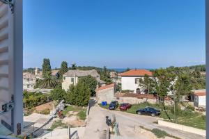 a view of a street in a residential neighbourhood at Apartment Karin in Veli Lošinj