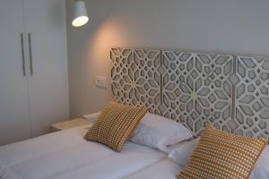 Posteľ alebo postele v izbe v ubytovaní GRETA PLAYA PANORAMA APARTAMENTO by AlohaMalaga