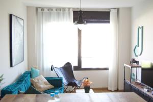 Televízia a/alebo spoločenská miestnosť v ubytovaní GRETA PLAYA PANORAMA APARTAMENTO by AlohaMalaga