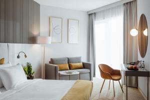 Posteľ alebo postele v izbe v ubytovaní Crystal Mountain Hotel Wisła