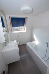 Ванная комната в Vakantiehuisje De Panne vlak aan Plopsaland en de zee