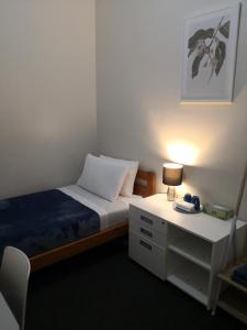 Postel nebo postele na pokoji v ubytování Oceanic Hostel