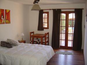 En eller flere senge i et værelse på Posada el Paraiso