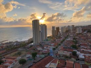 an aerial view of a city with the ocean at APARTAMENTO EM NATAL III in Natal