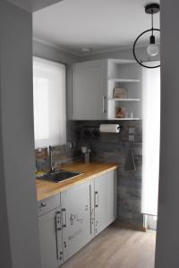A cozinha ou cozinha compacta de Artemis Boutique House