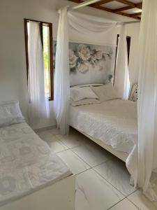 מיטה או מיטות בחדר ב-Casa Branca do Paiva