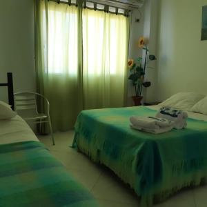Voodi või voodid majutusasutuse Blanco Mar Hotel toas