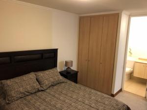 Postel nebo postele na pokoji v ubytování Departamento en Papudo Laguna + 6 fotografií