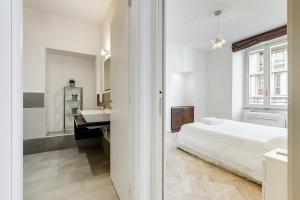 A bed or beds in a room at Vatican Andrea's house
