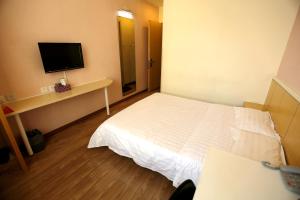 Postel nebo postele na pokoji v ubytování Beijing Sicily Hotel