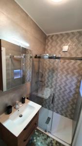 a bathroom with a shower and a sink at Slow motion in Kaštela +27 photos