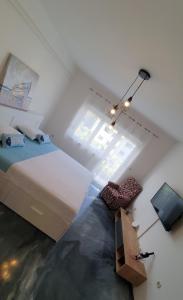 a bedroom with a large bed and a window at Slow motion in Kaštela