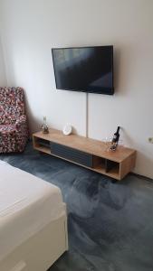 a living room with a flat screen tv on the wall at Slow motion in Kaštela