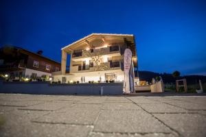 a large white building with a sign in front of it at Enjoy The Alps in Flachau