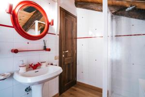 a bathroom with a sink and a mirror at Le Rascard in Valtournenche +27 photos