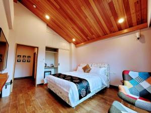 Voodi või voodid majutusasutuse 山水奇異San Shuei Kiwi桃園市民宿編號038 Homestay toas