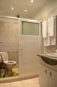a bathroom with a toilet and a sink at Midtown Place Apartment DORIS 1 with garage in Plovdiv +34 photos