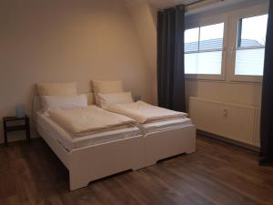 Postel nebo postele na pokoji v ubytování Ferienwohnung Jung