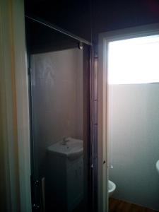 a bathroom with a sink and a toilet in it at 2 berth first floor flat Apsley 4 in Great Yarmouth
