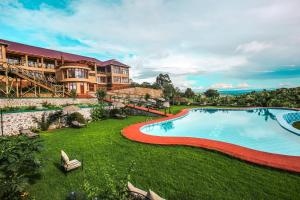 an image of a resort with a large swimming pool at Ngorongoro Marera Mountain View Lodge in Karatu