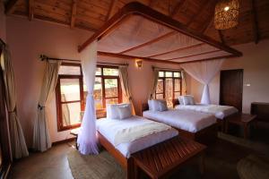 Katil atau katil-katil dalam bilik di Ngorongoro Marera Mountain View Lodge