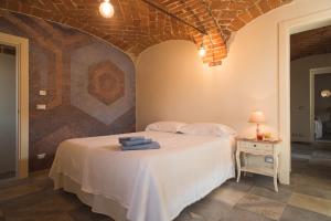 A bed or beds in a room at Acini e Rose