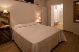 A bed or beds in a room at Acini e Rose