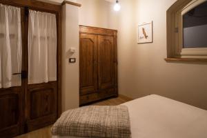 A bed or beds in a room at Acini e Rose
