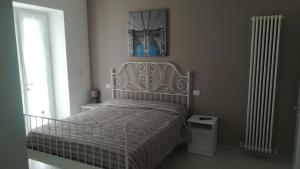 Posteľ alebo postele v izbe v ubytovaní Ostello Villafranca