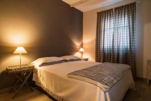 A bed or beds in a room at Acini e Rose