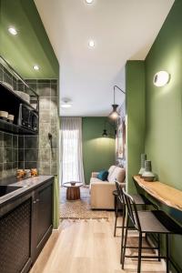 a kitchen with a stove, sink, and cabinets at Mr. Soof - By TLV2GO in Eilat