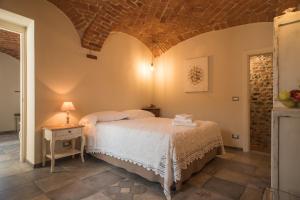 A bed or beds in a room at Acini e Rose