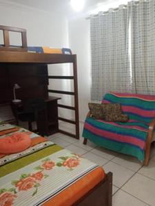 Katil atau katil-katil dalam bilik di Sua casa na praia em Cabo Frio