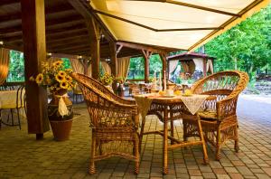 a table and chairs under an umbrella on a patio at Oberig in Morshin