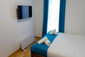 Ένα ή περισσότερα κρεβάτια σε δωμάτιο στο Apartman Tuscany