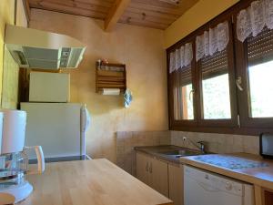 A kitchen or kitchenette at GITE*** DES BARAQUES