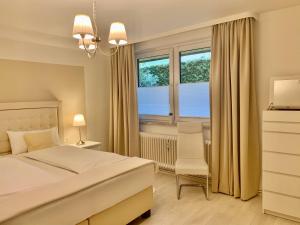 Ein Bett oder Betten in einem Zimmer der Unterkunft FeWo im Grünen mit Terrasse und Garten - gratis Therme