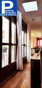 a living room with a sliding glass door in a house at Santa Ursula in Toledo