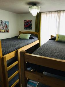 Voodi või voodid majutusasutuse Departamento Santiago Centro Full Equipado toas