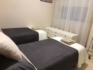 Posteľ alebo postele v izbe v ubytovaní Apartamento Completo Regina