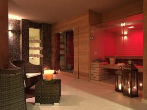 a large bathroom with a sink and a room with a tub at Hotel Natura in Castel di Sangro
